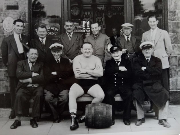 The Hammersmith born wrestler with a group of admirers 