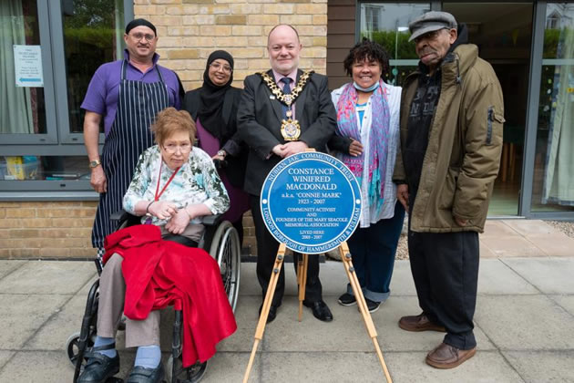 Mayor of H&F, Cllr PJ Murphy (pictured centre) presents the Connie Mark blue plaque