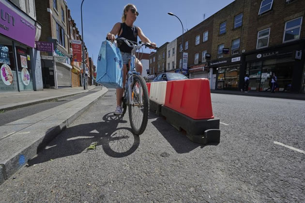 Red plastic barriers are to be replaced with wands 