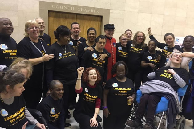 Angela Mooney (pictured second from left) with the Linking Hands Community Choir at Hammersmith Town Hall