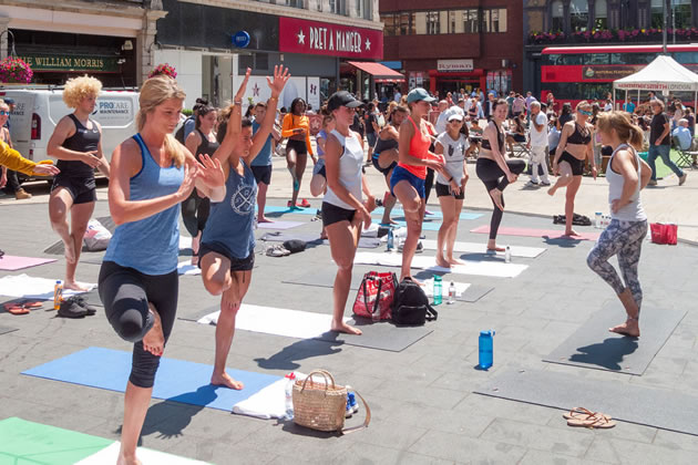 Yoga in Lyric Square during a previous festival