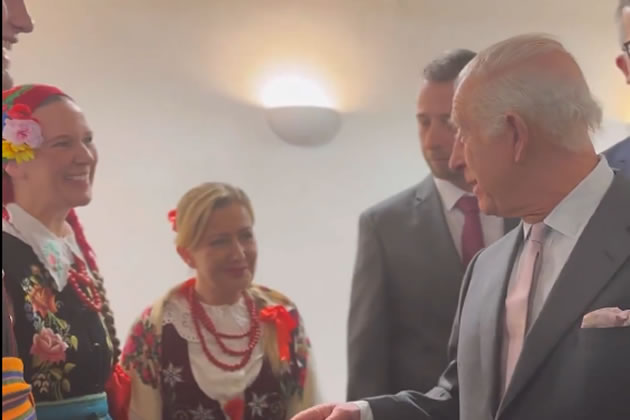 The King meets members of the Polish community in traditional dress 