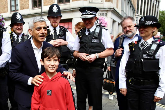 Sadiq Khan with police officers and a young person