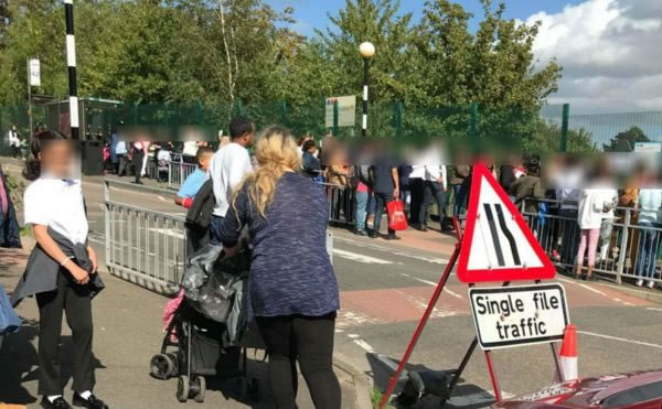 Parents waiting outside school gate